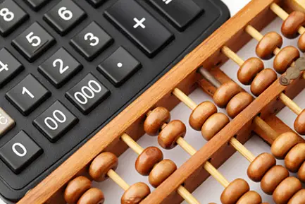Ancient abacus and modern calculator